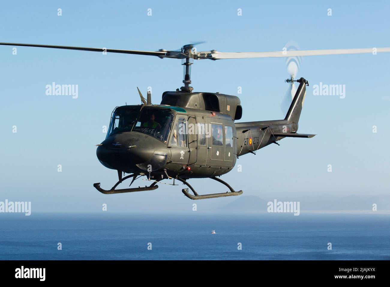 A Spanish Army Bell 212 in flight over the Atlantic Ocean. Stock Photo