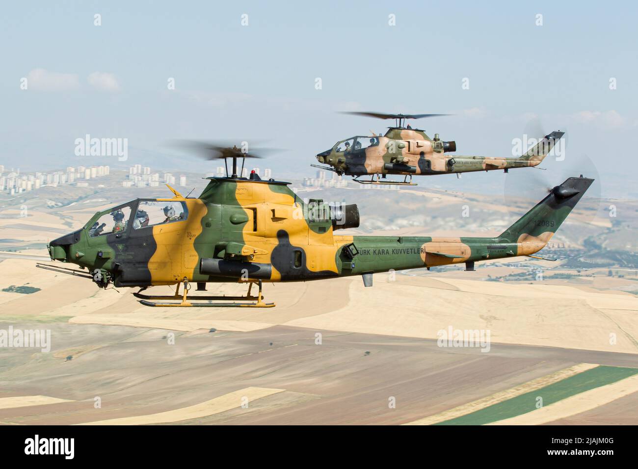 A pair of Turkish Army AH-1 Cobra attack helicopters during a training flight over Turkey. Stock Photo