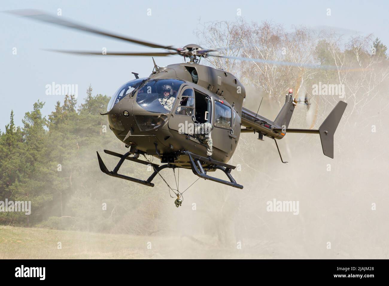 A U.S. Army UH-72 Lakota helicopter landing at the Hohenfels training area in Germany. Stock Photo