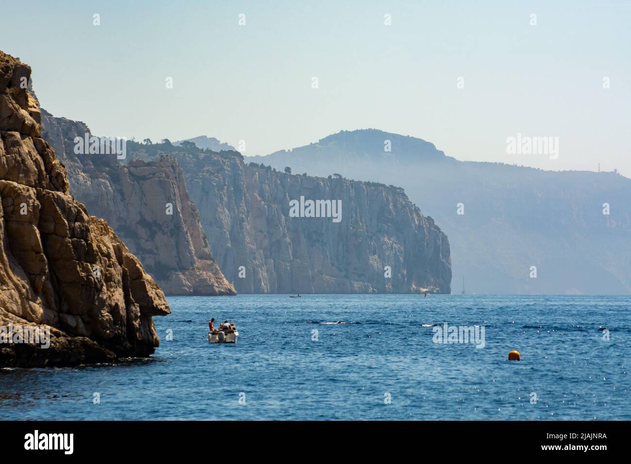 Limestone cliffs and blue sea near Cassis, boat excursion to Calanques ...