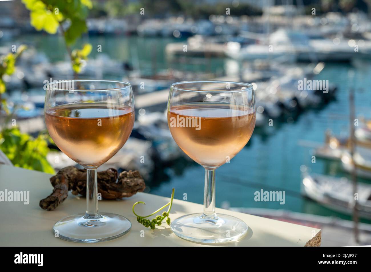 Cold rose Provencal wine in glasses served in sunlights on outdoor