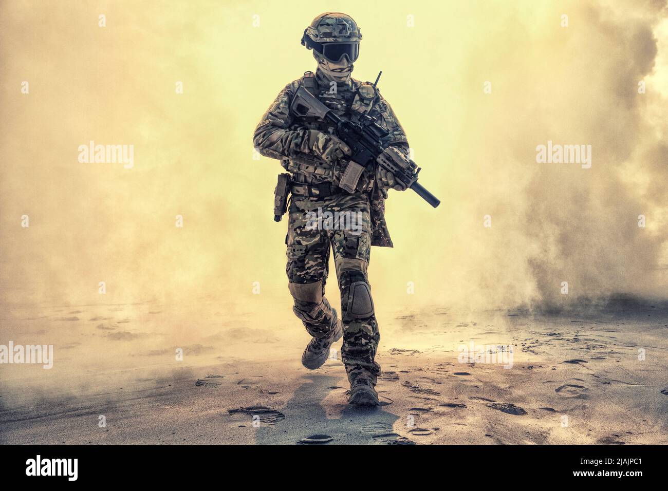 Army soldier breaking through battlefield covered in flames. Stock Photo
