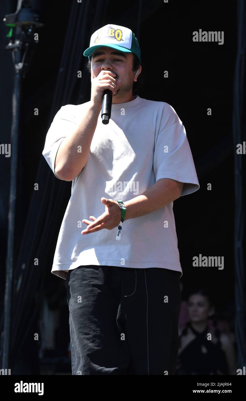 Rapper and singer Joseph Barros is shown performing on stage during a