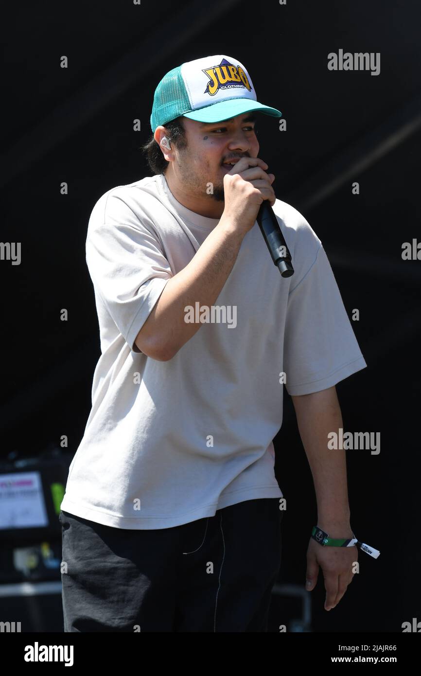 Rapper and singer Joseph Barros is shown performing on stage during a