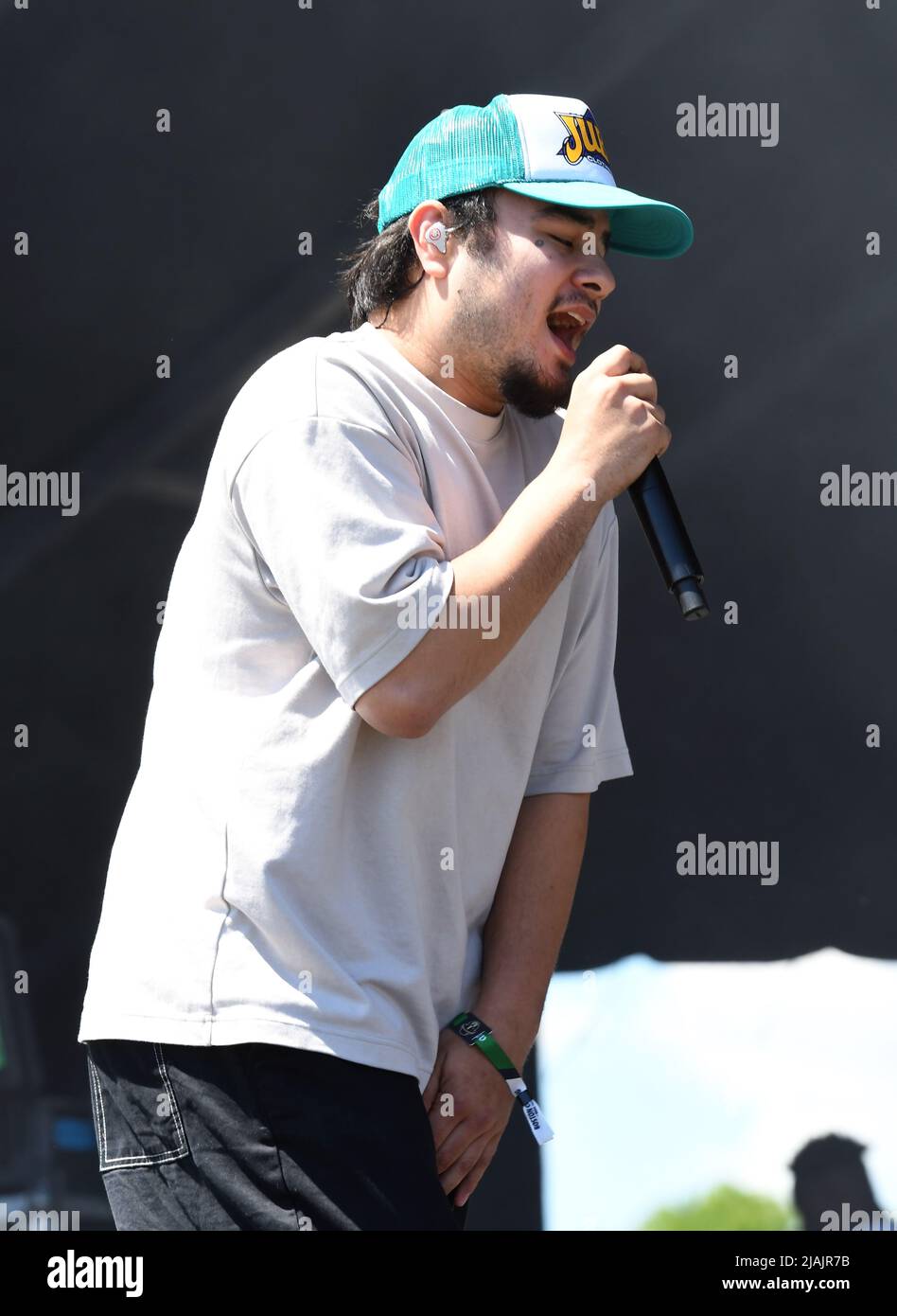 Rapper and singer Joseph Barros is shown performing on stage during a