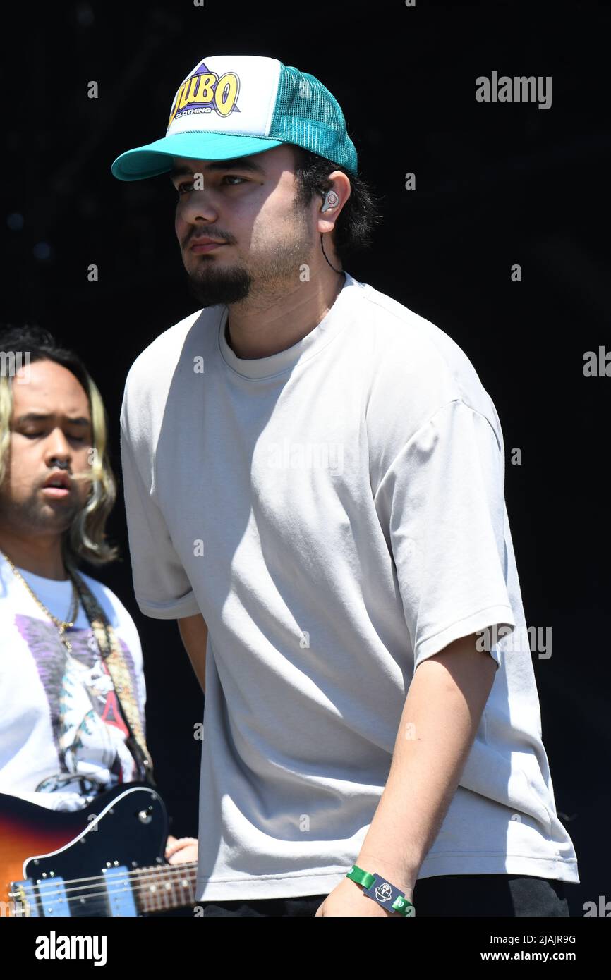 Rapper and singer Joseph Barros is shown performing on stage during a