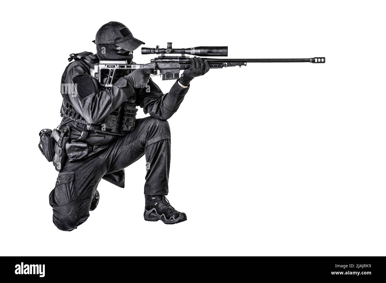 SWAT team sniper sitting and aiming with sniper rifle equipped telescopic optical sight. Stock Photo