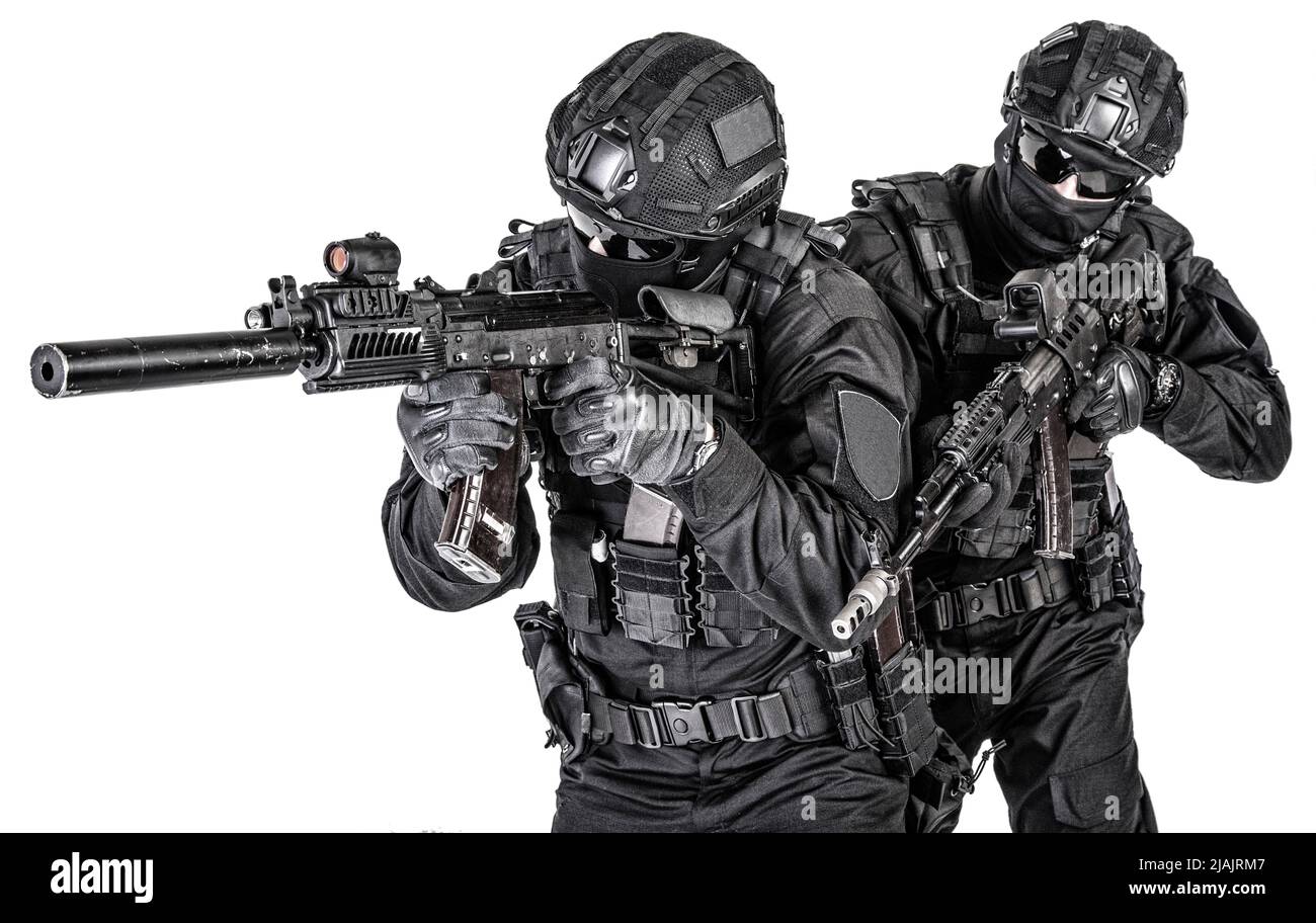 Two SWAT team fighters in black uniforms, armed with assault rifles ...
