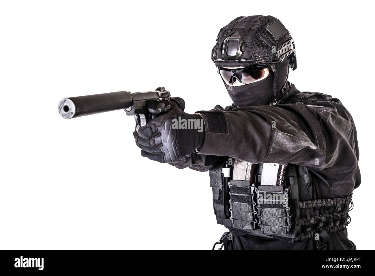 Studio portrait of SWAT officer aiming pistol with silencer on gun barrel. Stock Photo