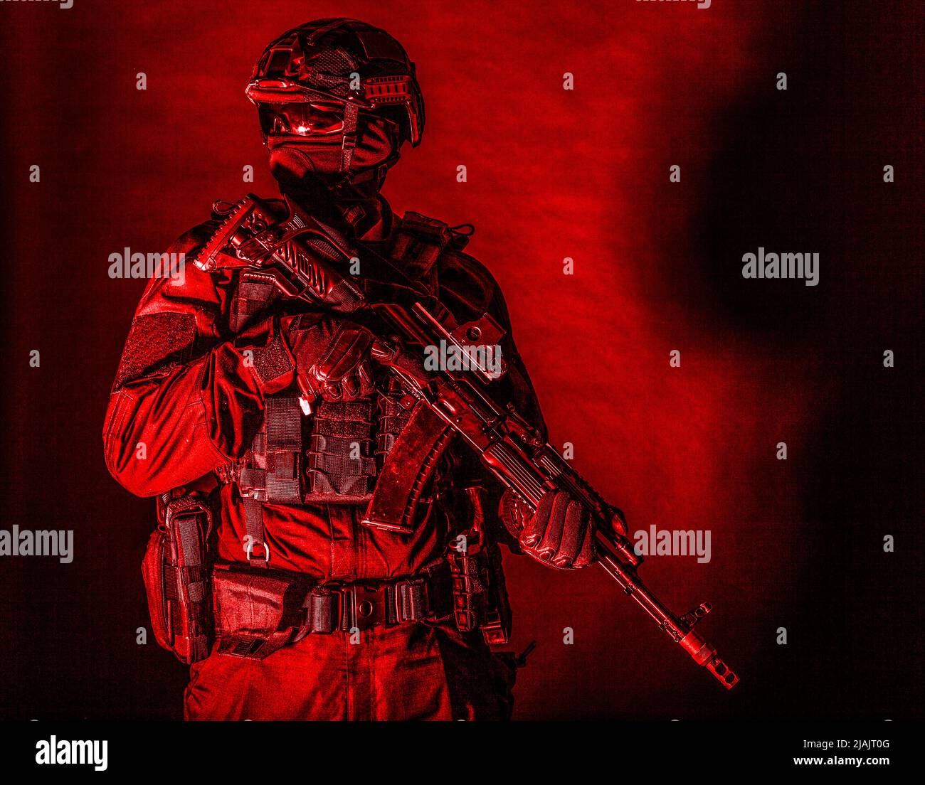 Special forces soldier equipped with service rifle, isolated on black