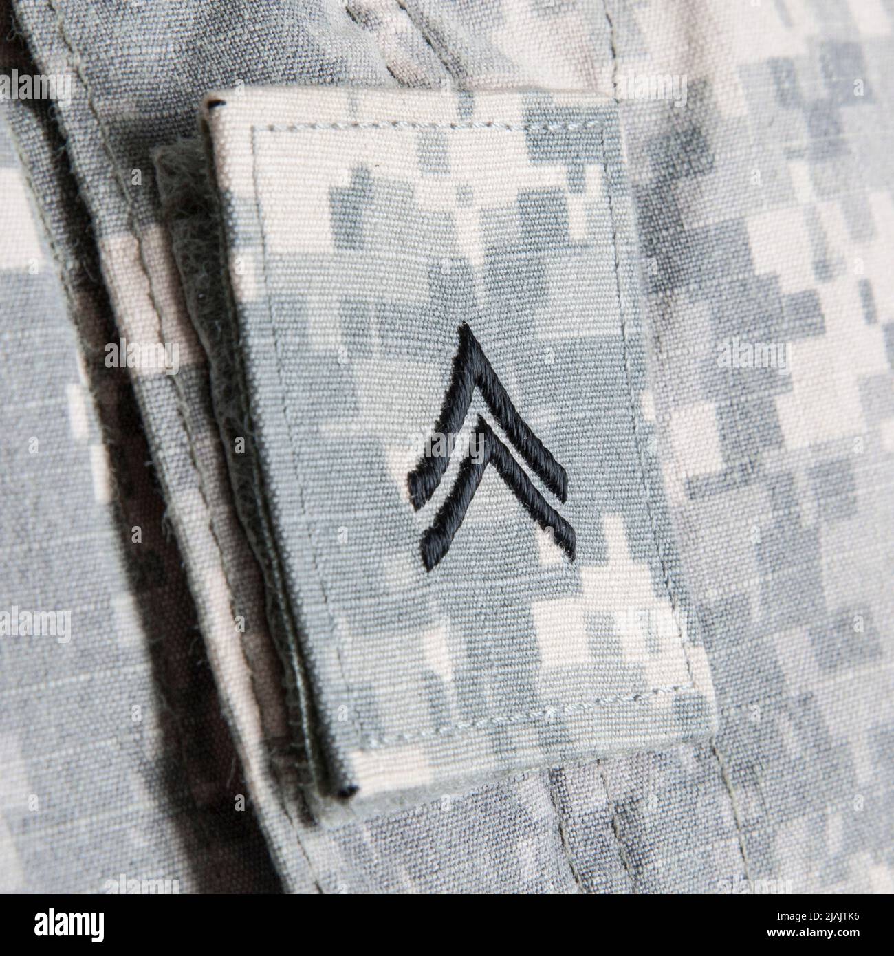 Close-up of U.S. Army soldiers corporal rank insignia embroidered on Army combat uniform. Stock Photo