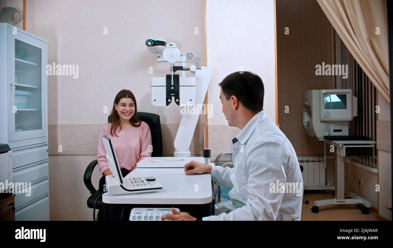 Ophthalmology treatment - young woman checking her visual acuity ...