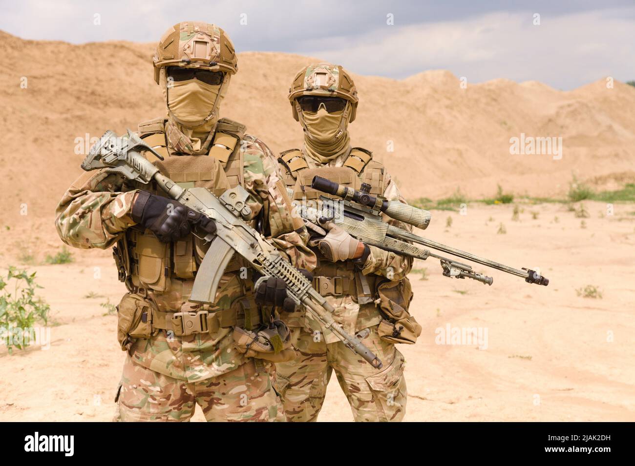 Portrait of two special forces soldiers during military operation in desert. Stock Photo