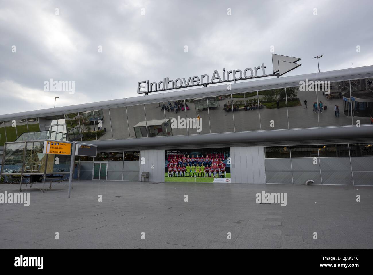 Eindhoven airport sign outside terminal building with photo of PSC Eindhoven football soccer team Stock Photo