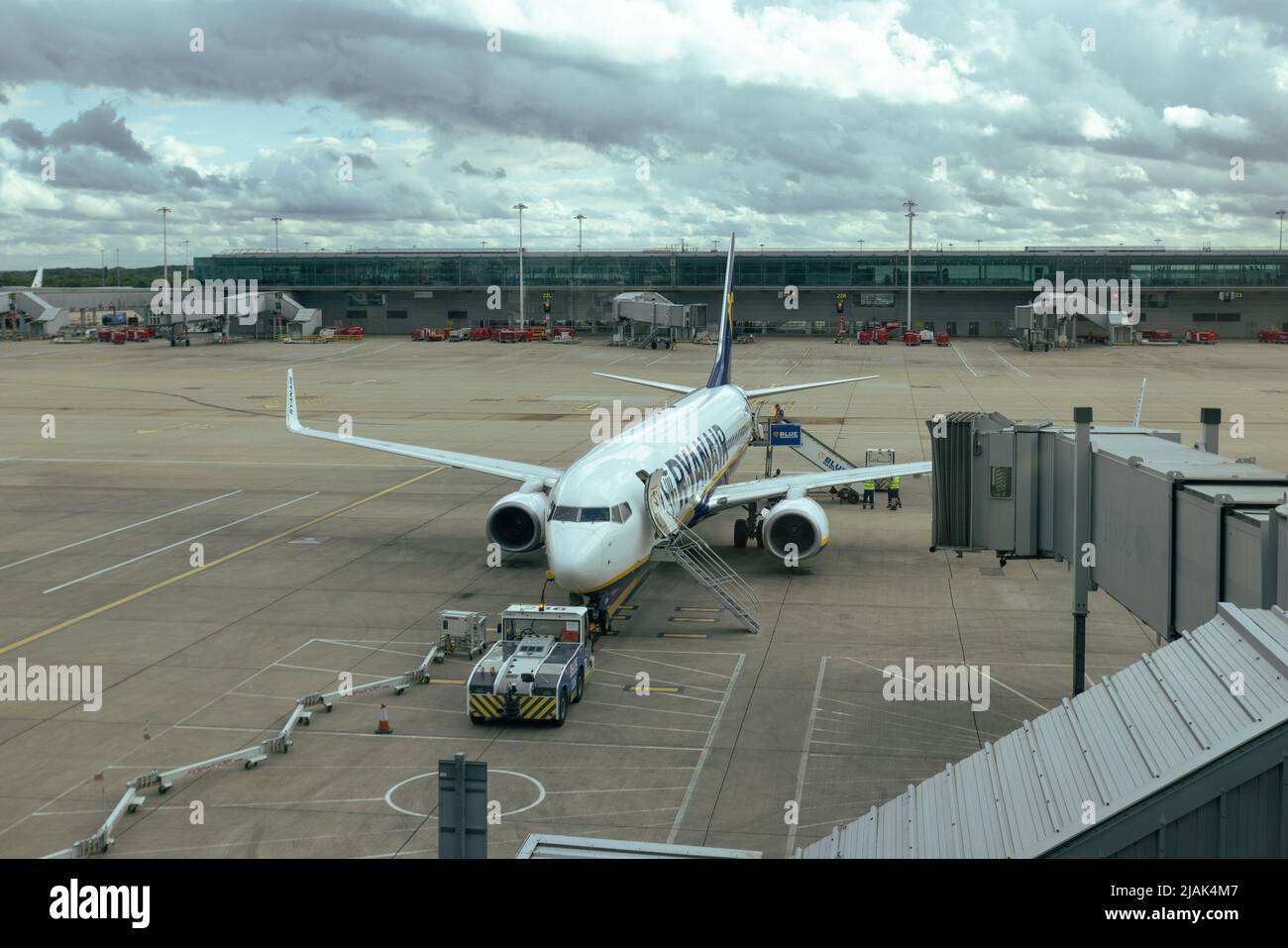 Ryanair airplane at London Stansted airport tarmac while vehicle is fuelling the aircraft Stock Photo