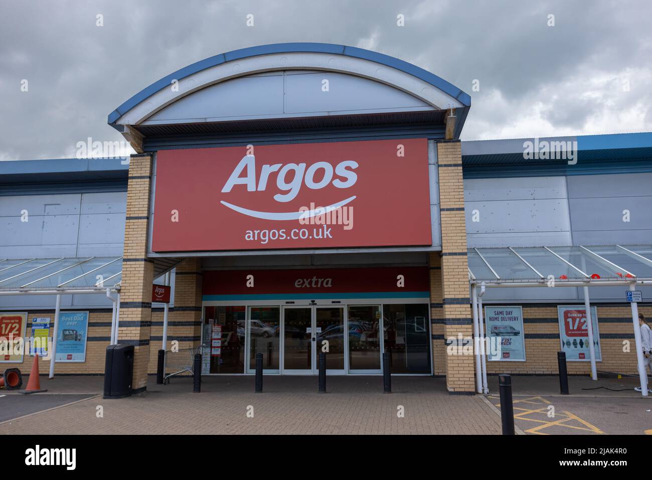 Argos store entrance. Big red and white sign over glass doors. Argos is a British catalogue and shop retailer in the UK Stock Photo