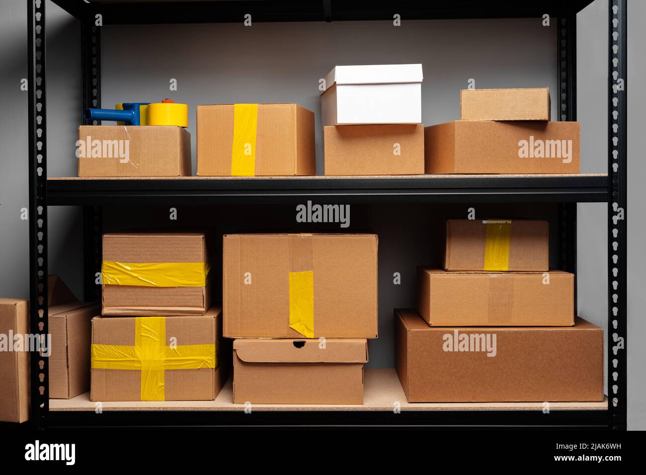 Rack shelves with paper boxes in warehouse Stock Photo - Alamy