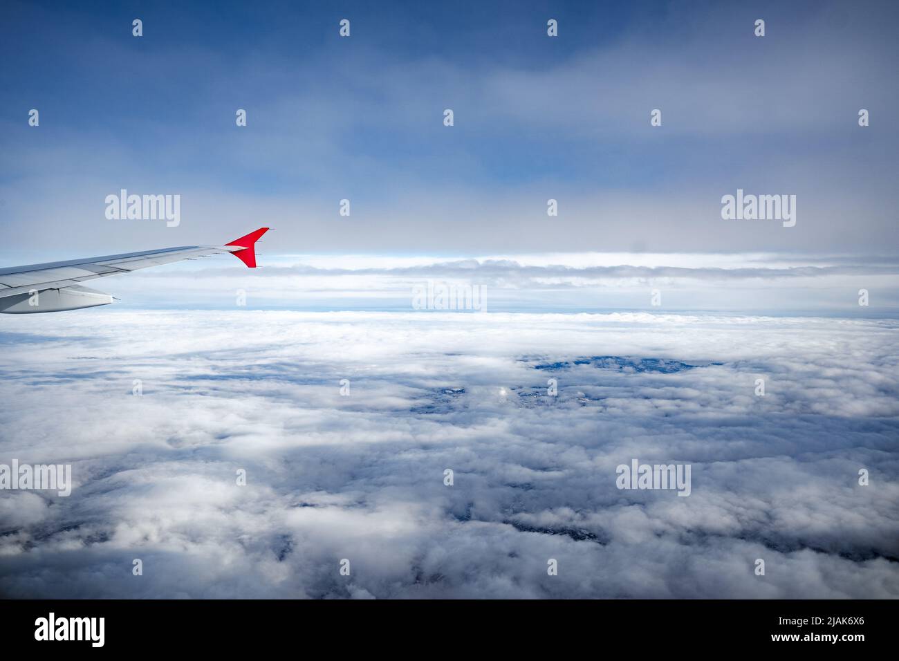 Aircraft wing above beautiful clouds and blue sky Stock Photo - Alamy