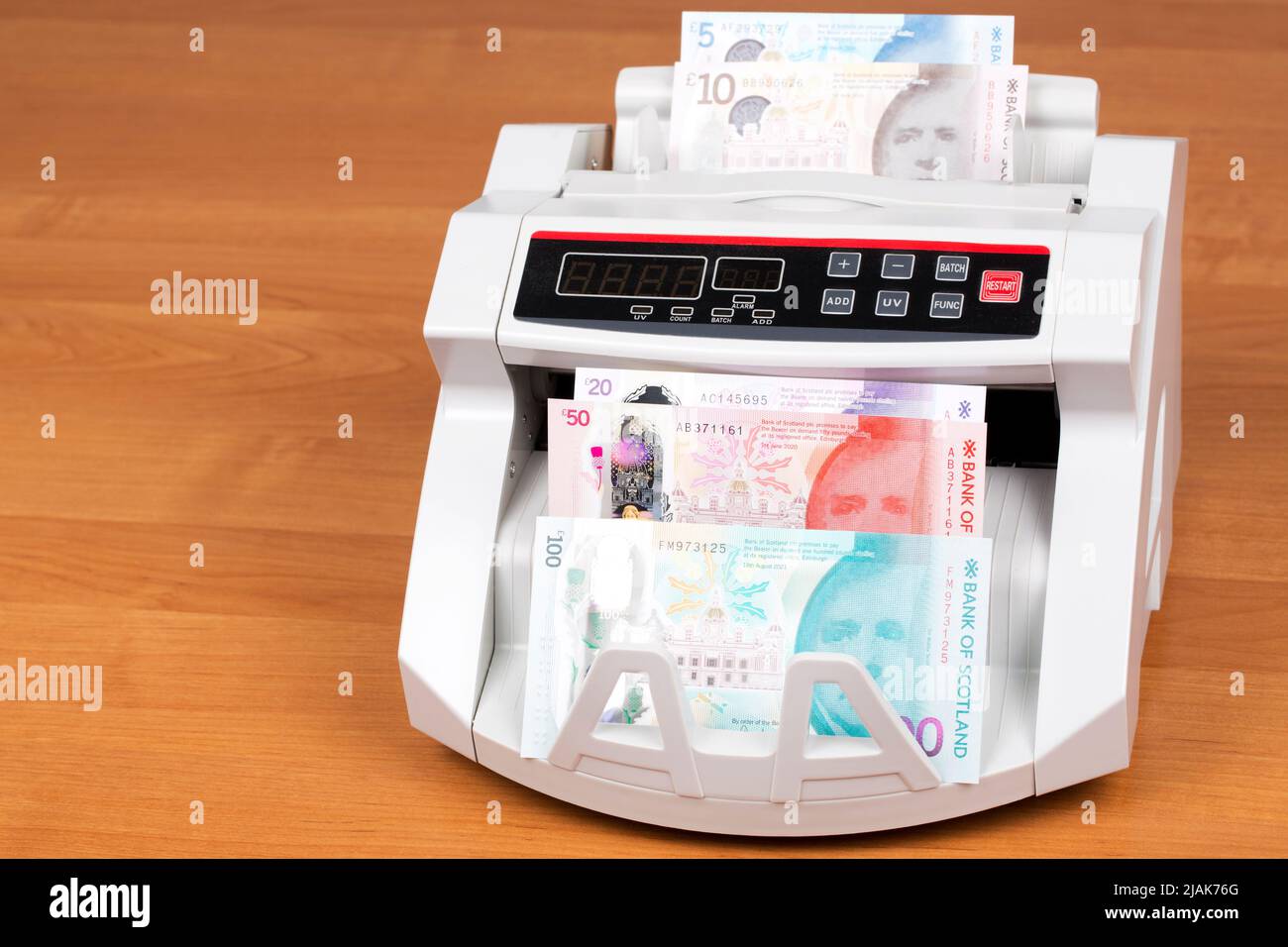 Scottish money - Pounds in a counting machine Stock Photo