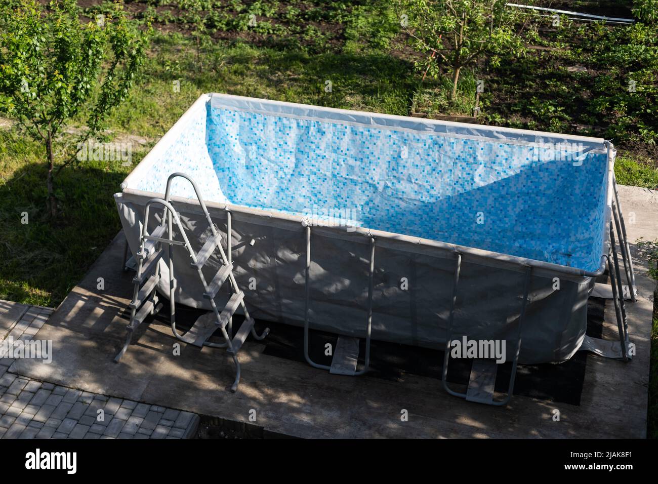Empty above ground swimming pool in a backyard Stock Photo Alamy