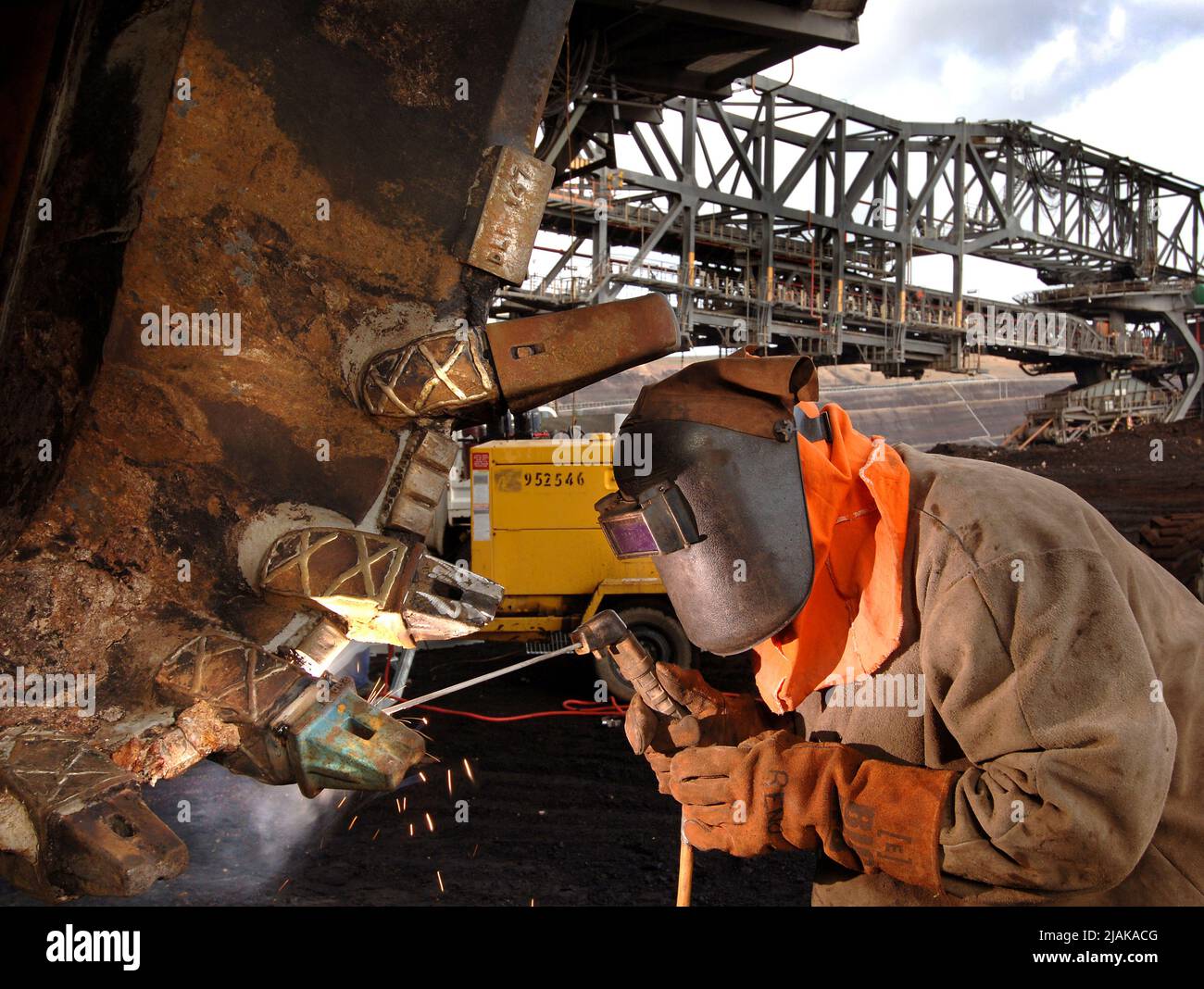 The Loy Yang open cut coal mining in the Latrobe Valley -Victoria Australia-during shutdown welder maintenance to bucket dredge. Stock Photo