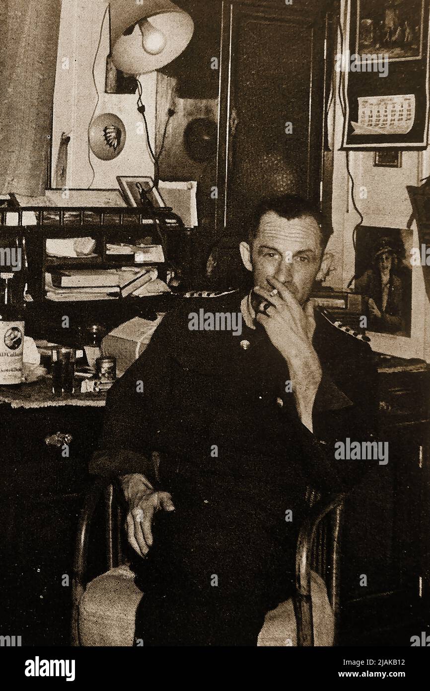 A portrait of the captain  (believed to be  New Zealander Horace Stanley Collier) of the Pamir sailing ship in his cabin (circa 1946). She was a four-masted barque built for the German shipping company F. Laeisz  at  Blohm & Voss shipyards in Hamburg  A famous Flying P-Liners, she was the last commercial sailing ship to round Cape Horn, in 1949. She ended her days when she was sunk  during Hurricane Carrie on  21 September 1957 off the Azores. Only 6 survived. Stock Photo