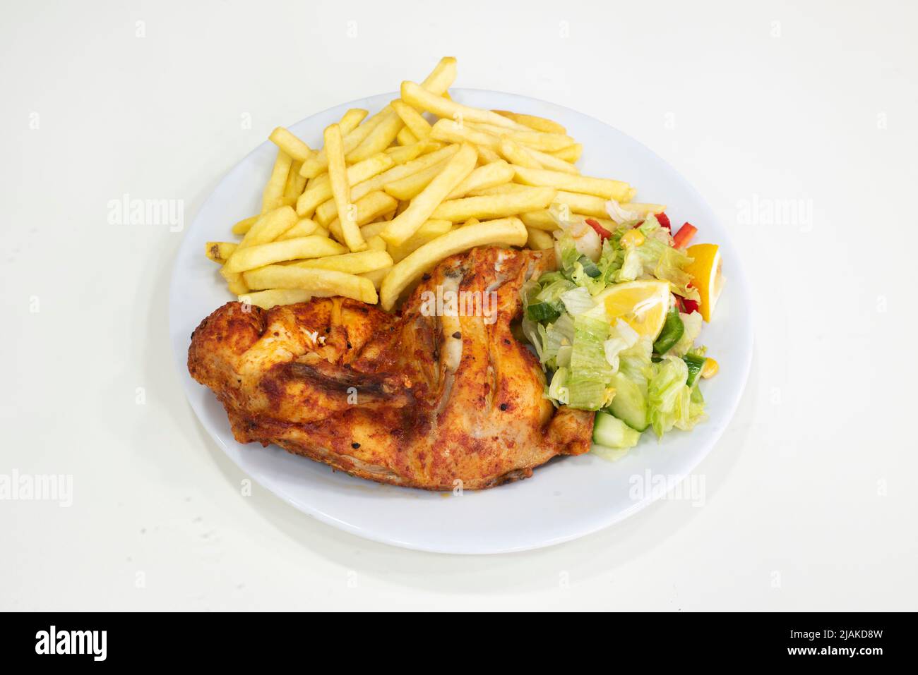 Yorkshire, UK – 18 March 2019: delicious half peri peri chicken with chips or rice, Dixy Chicken, Doncaster Stock Photo