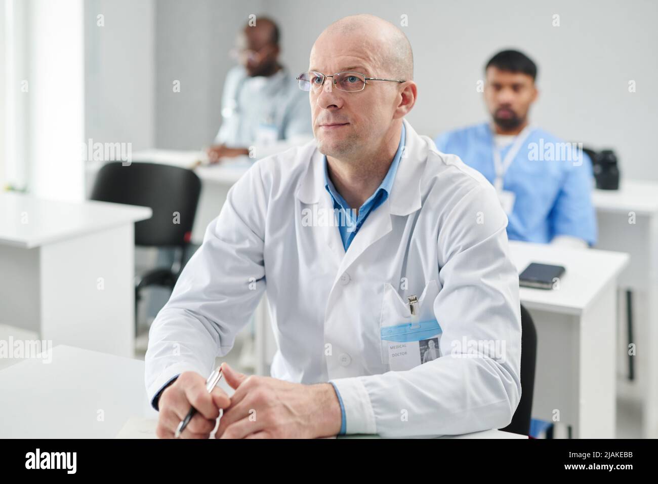 Serious mature male doctor hi-res stock photography and images - Alamy