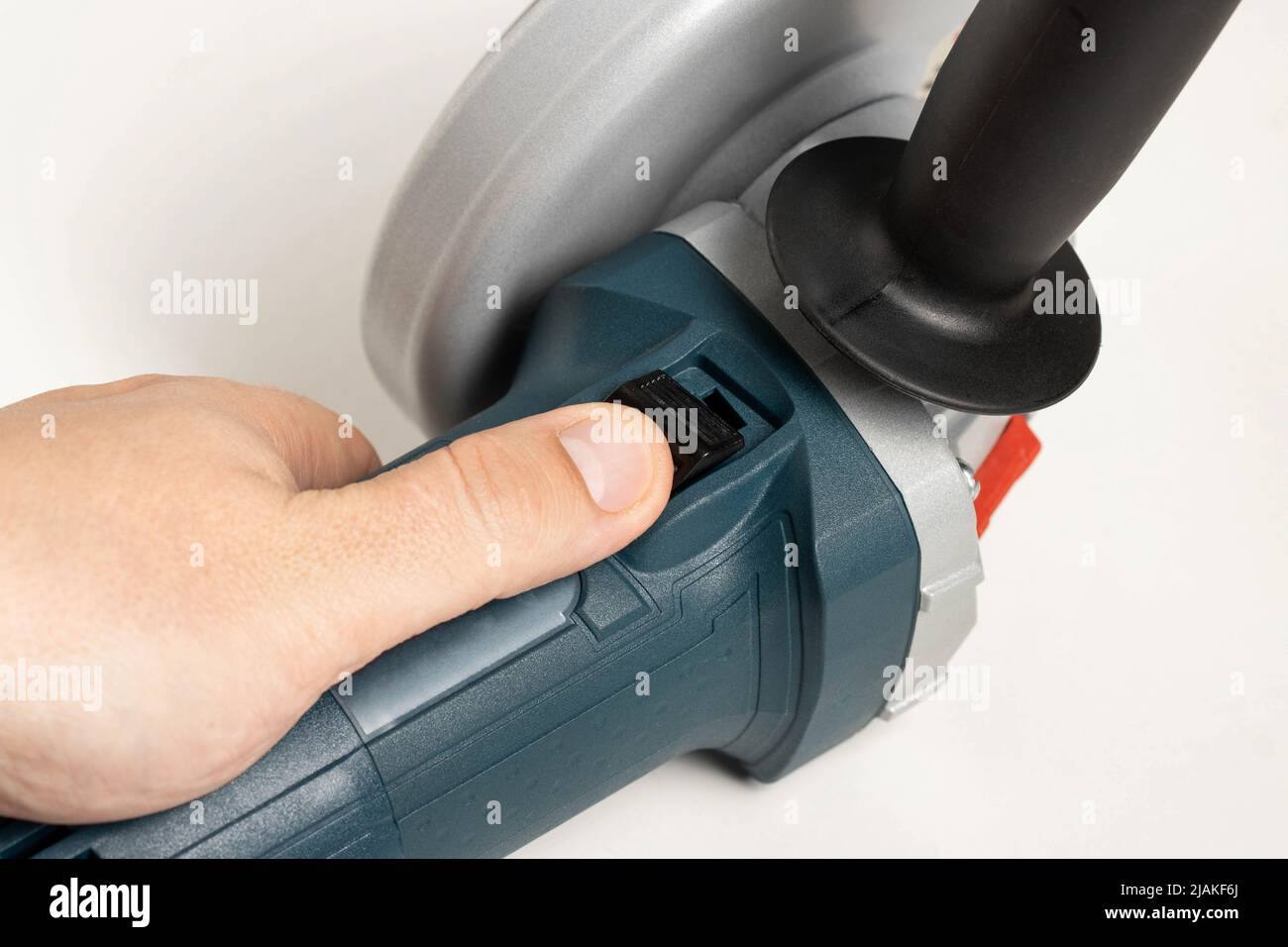 Activation of an angle grinder with soft start function Stock Photo Alamy