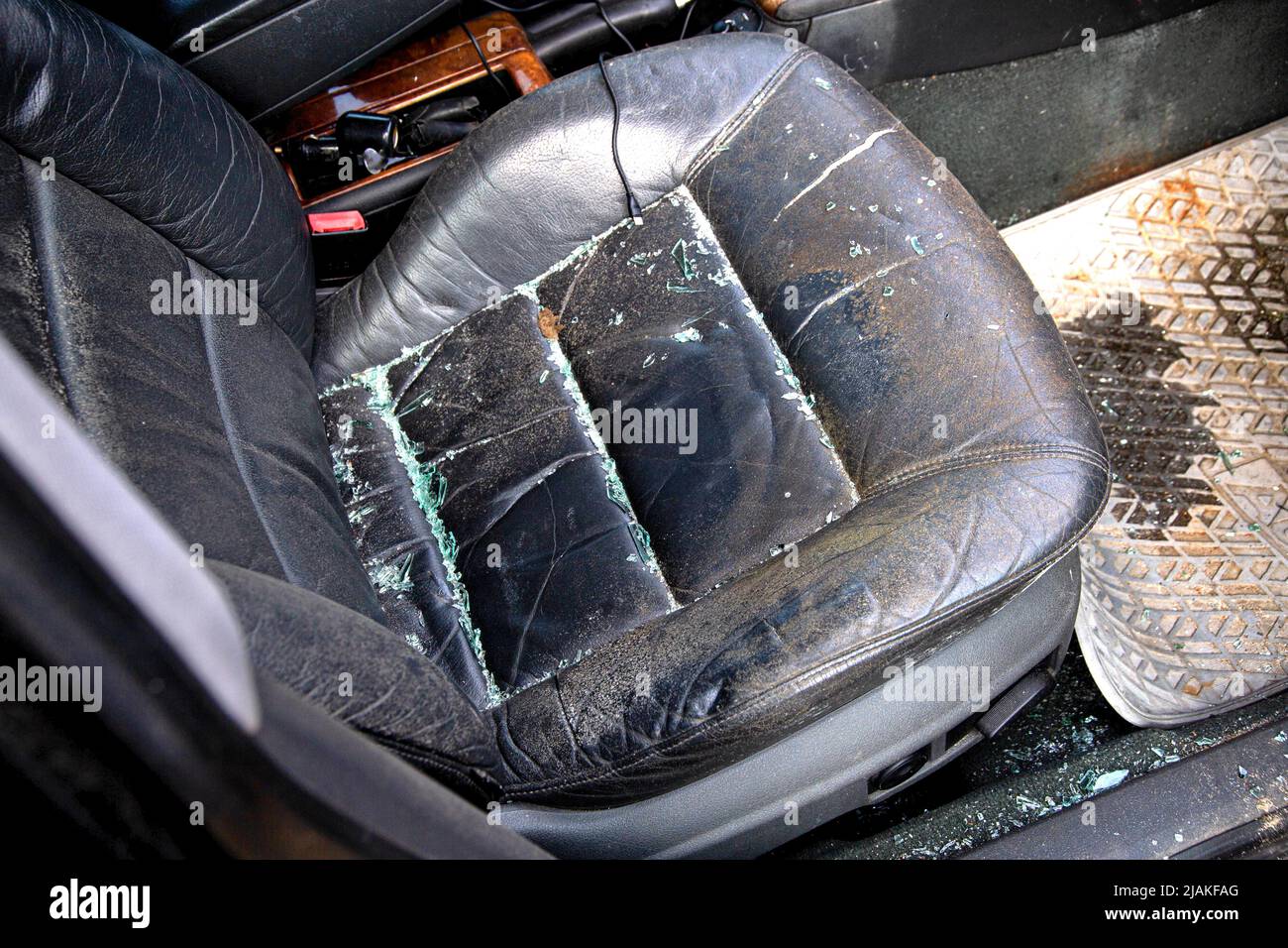 Shards of a windshield in a car after an accident on the road. Road safety. Pedestrian and car insurance Stock Photo