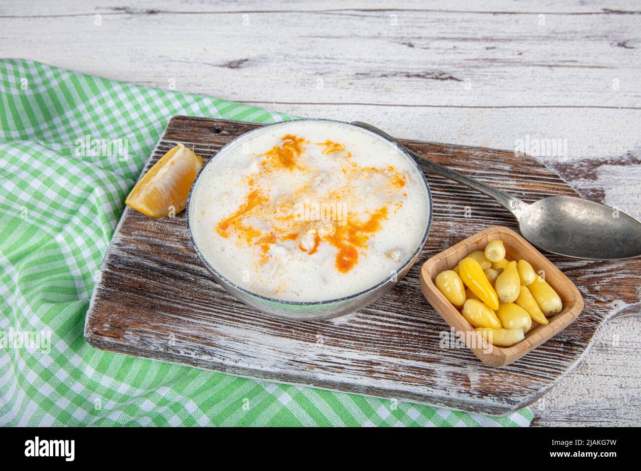 Turkish Paca Turkish Traditional Tripe Soup with bread on white rustic wooden ...