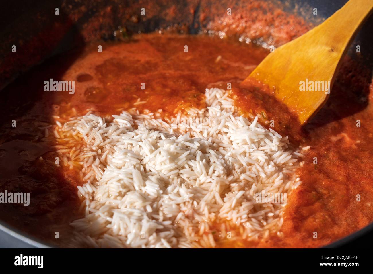 Jollof rice closeup. Background of rice cooked in tomato paste with