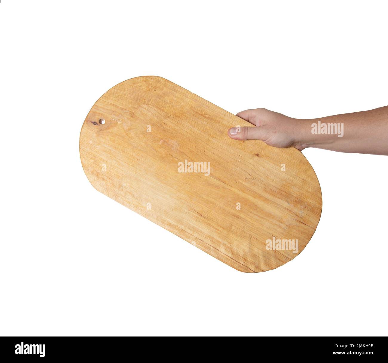 kitchen board for cutting meat in a man's hand on a white background, isolate. Close-up, object Stock Photo