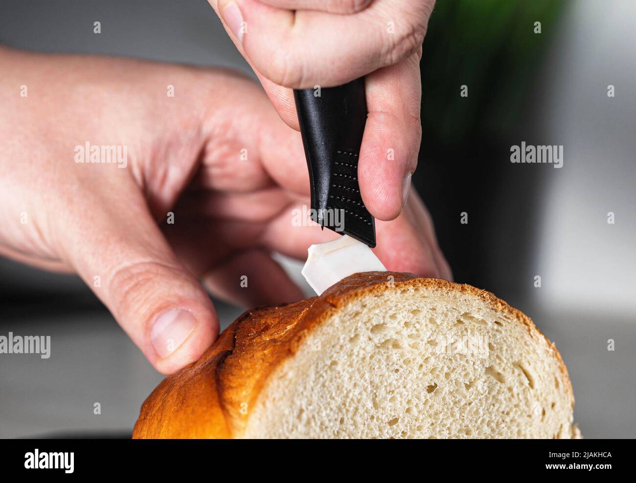 Broken ceramic knife while cutting a loaf in the kitchen. Poor quality
