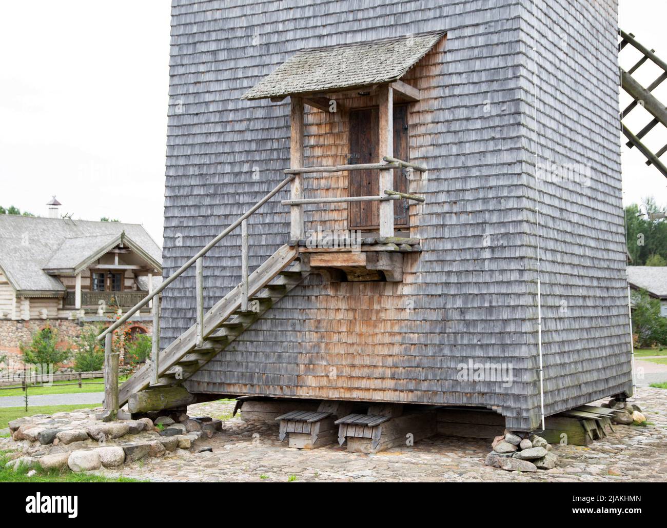 Staircase with door and entrance in an old wooden mill Stock Photo
