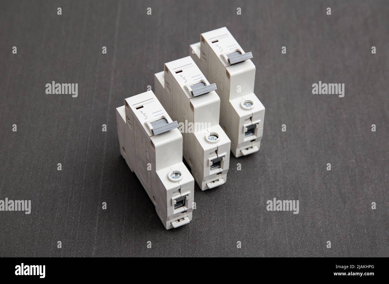 Electrical circuit breakers on a gray background, close-up. Designed for switching electrical circuits and their protection. Electromagnetic short cir Stock Photo