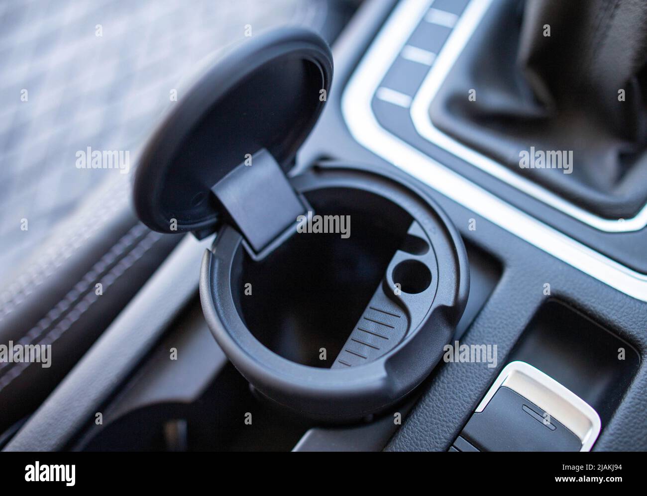 Modern ashtray for cigarettes, close-up. Smoking in the car, interior Stock Photo