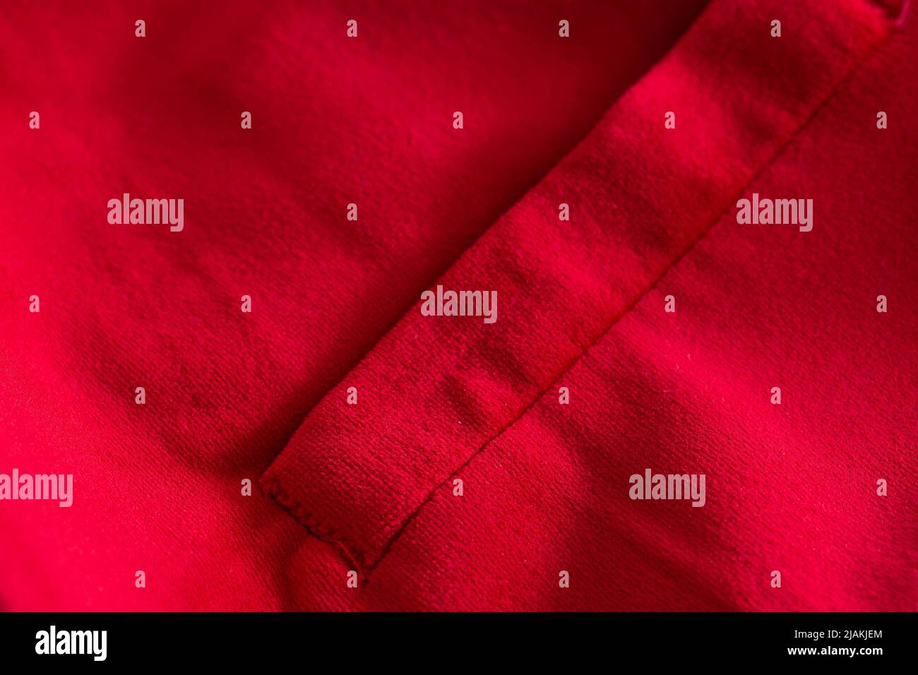 Red stylish jacket with pocket, background. Stylish clothes Stock Photo