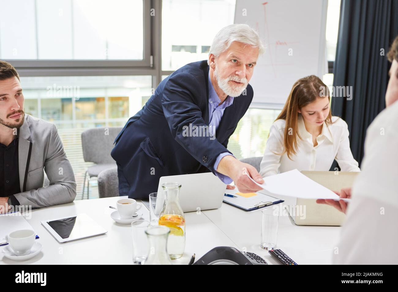 Employer or manager presents trainee or employee with an employment contract Stock Photo