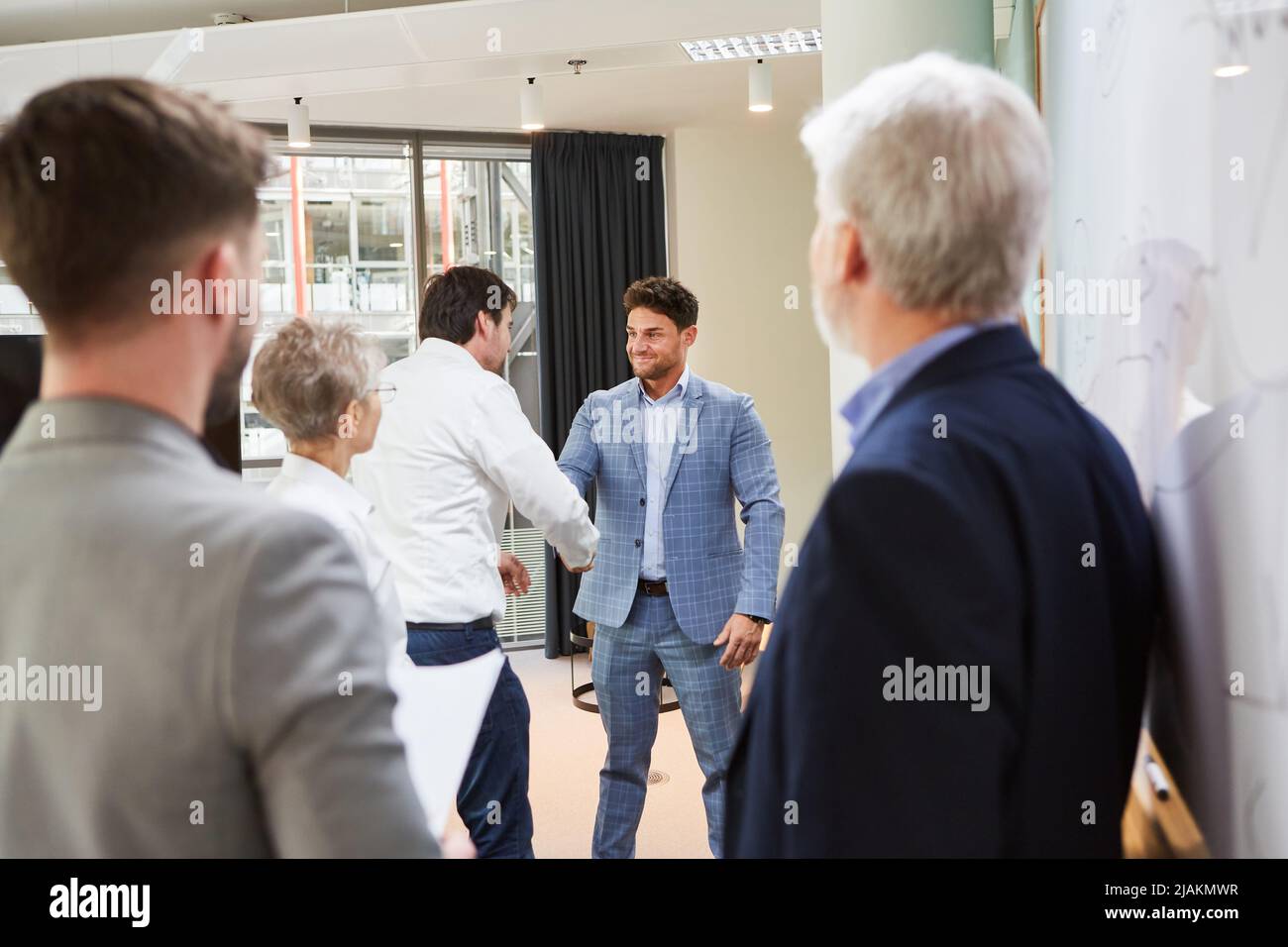 Two business partners handshake in office for business deal and partnership Stock Photo