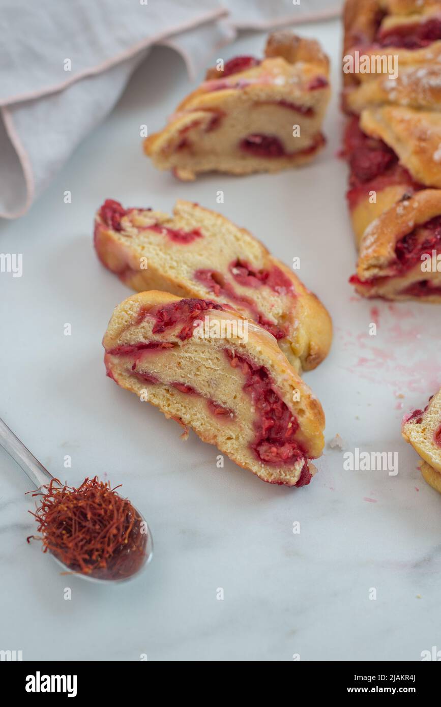 sweet home made saffron babka brioche with raspberries Stock Photo