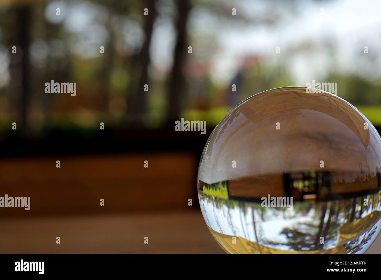 landscape with glass lens ball in the garden Stock Photo