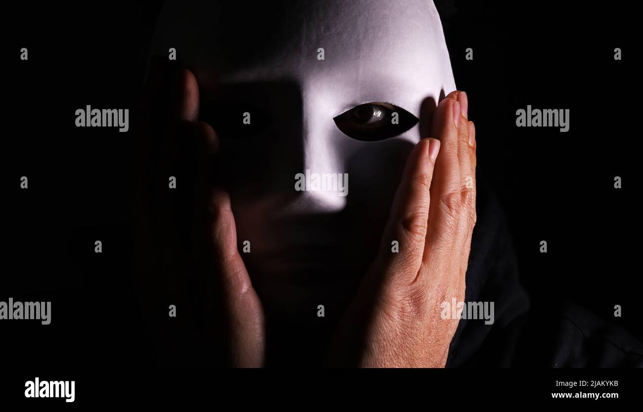 Person with a mask hi-res stock photography and images - Alamy