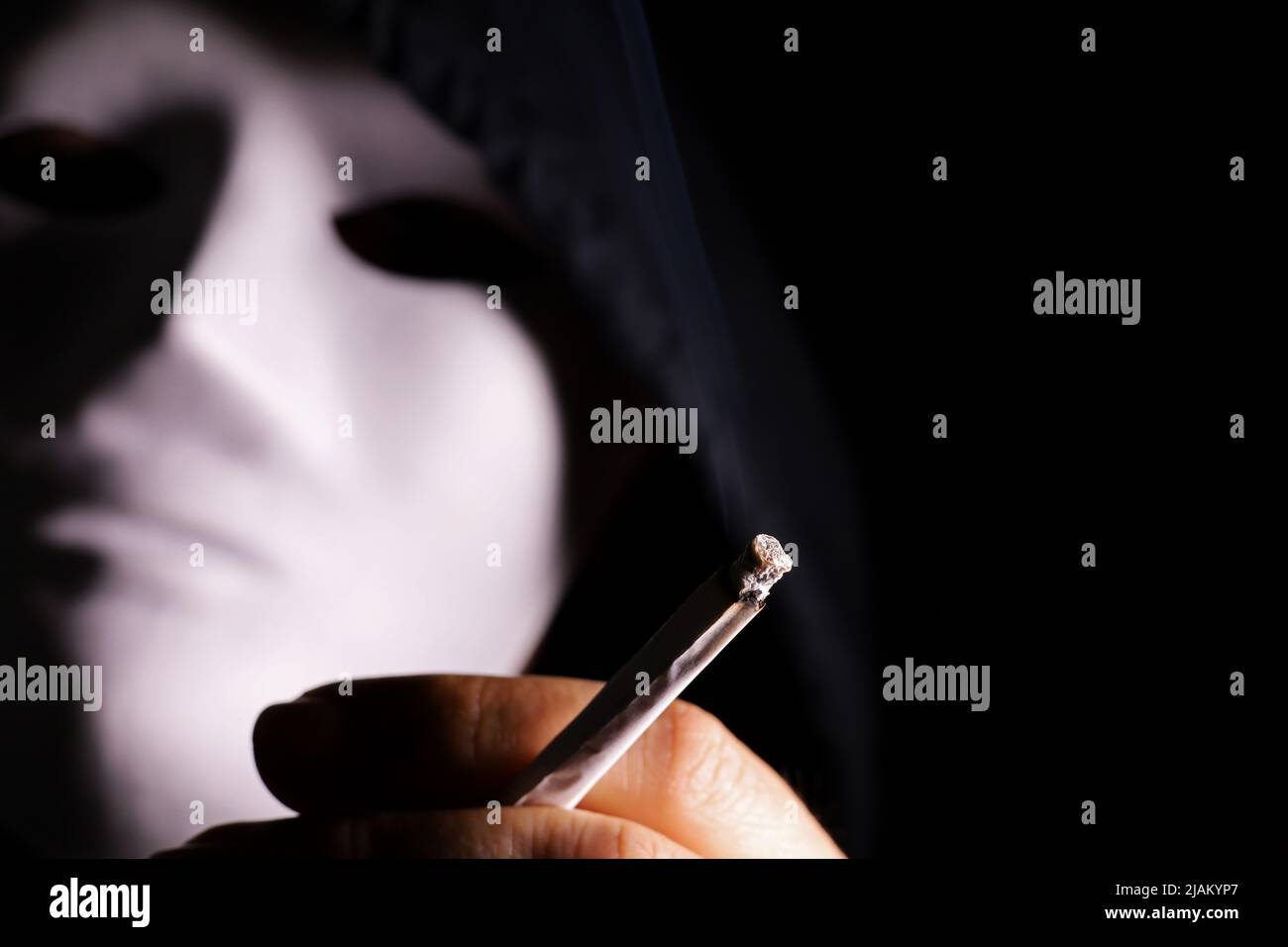 cigarette masking Smoking with mask hi-res stock photography and images
