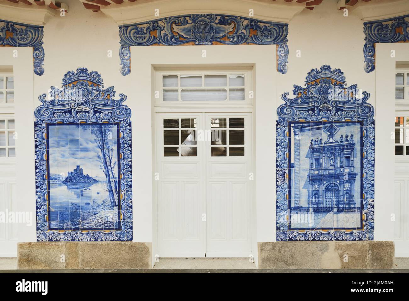 detail of a panel of azulejos tiles showing a church on the facade of ...