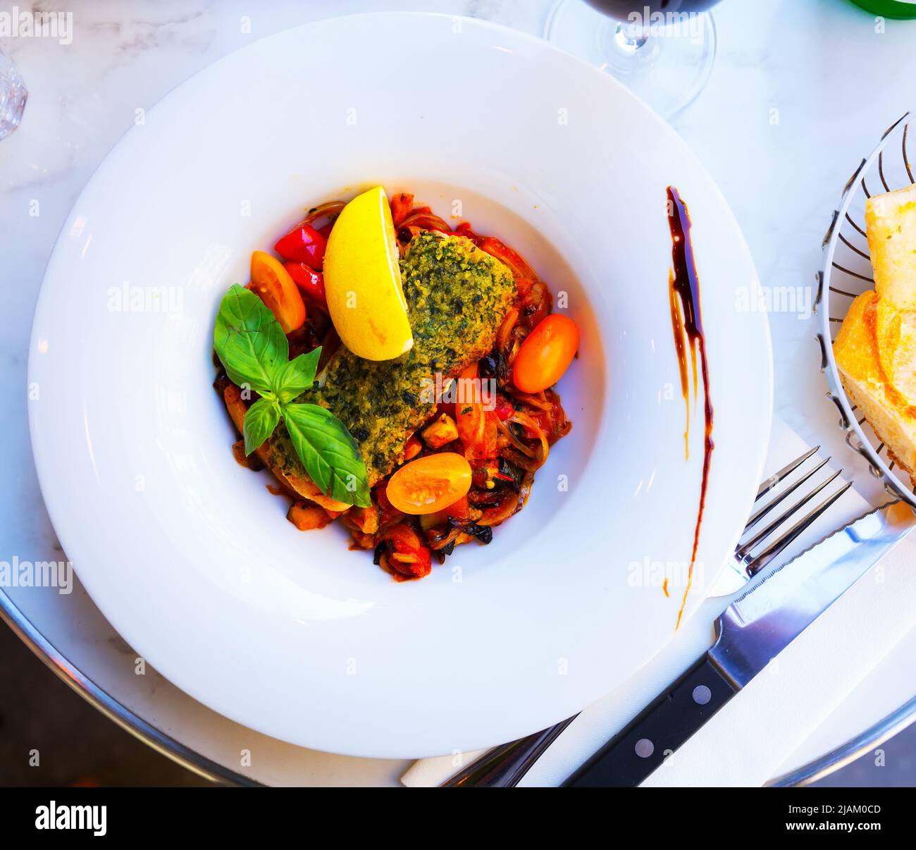 White fish baked with vegetables Stock Photo - Alamy