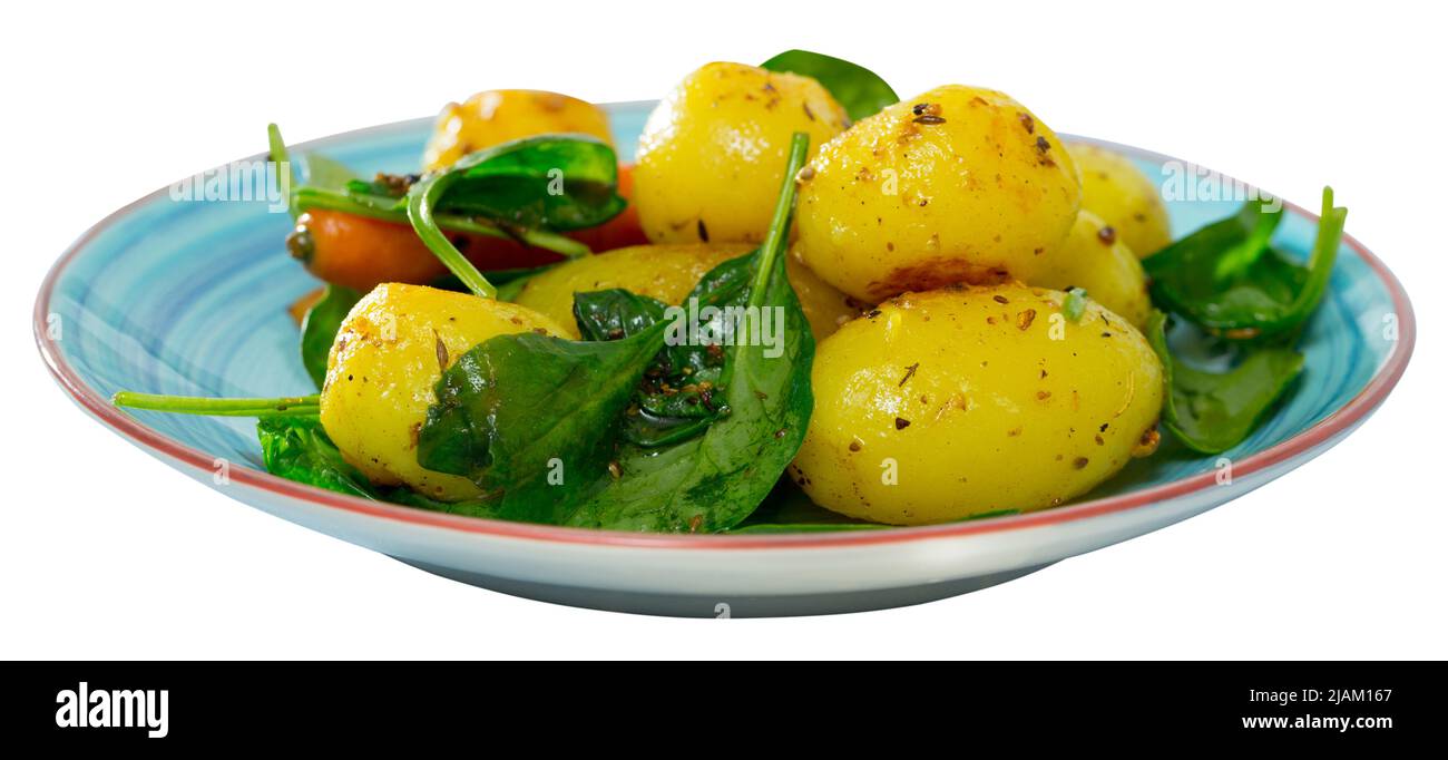 Baked new potatoes with spinach Stock Photo - Alamy