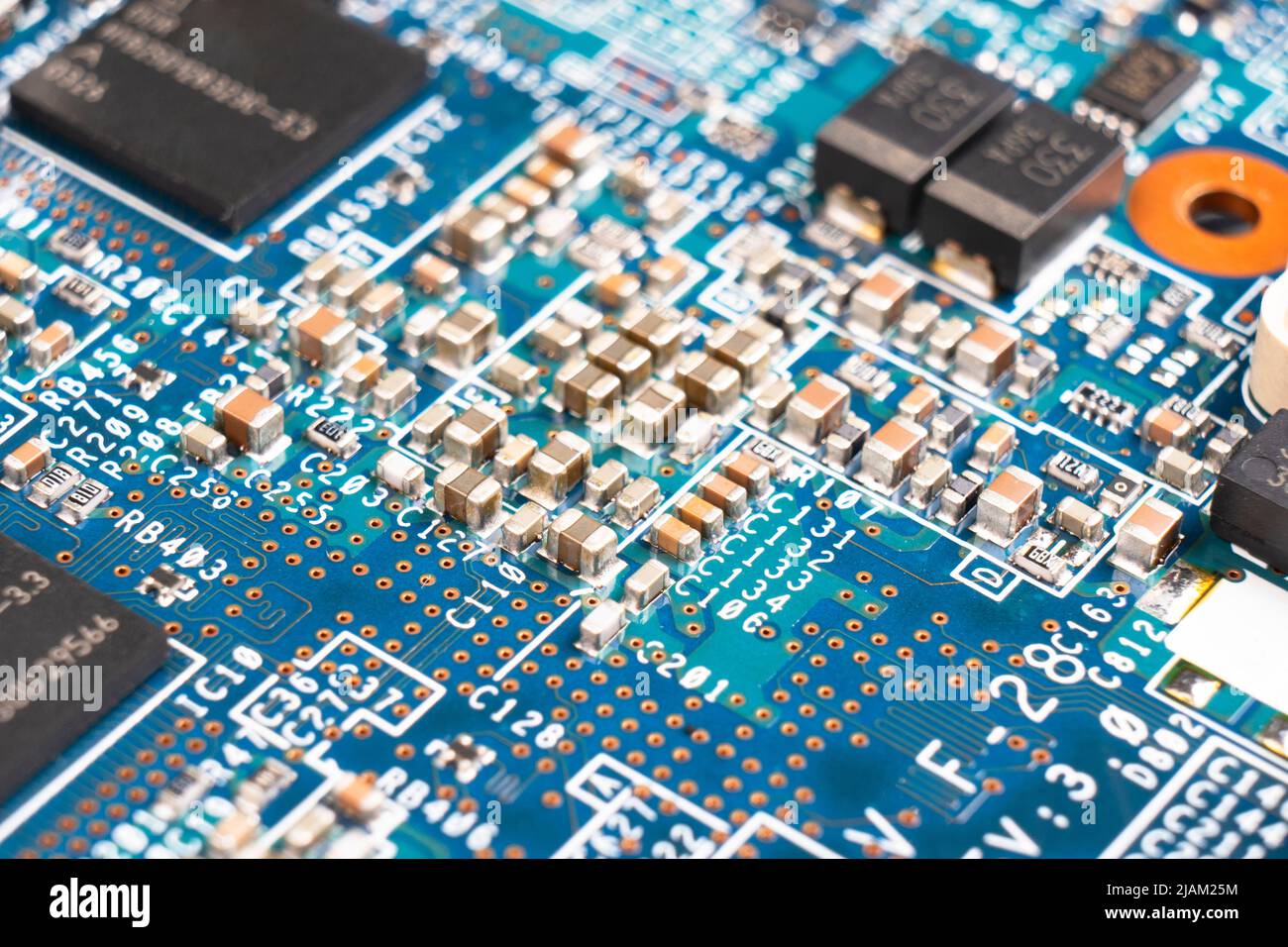 Macro shot of Circuit board with resistors microchips and electronic ...