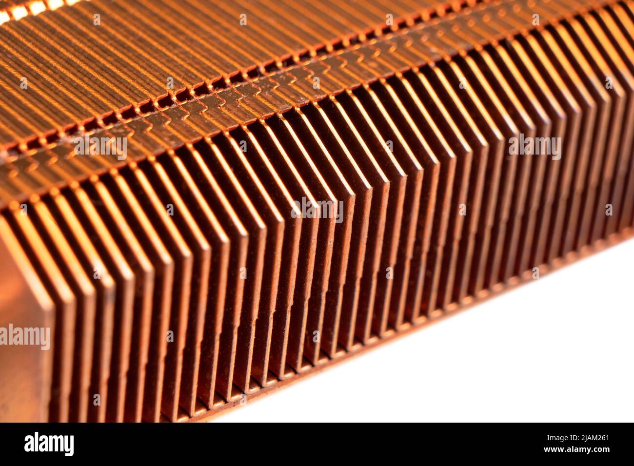 Macro shot heatsink on laptop motherboard. CPU heatsink cooler of the computer laptop. Thin cooling blades of an metal radiator. Cooling fins of a com Stock Photo