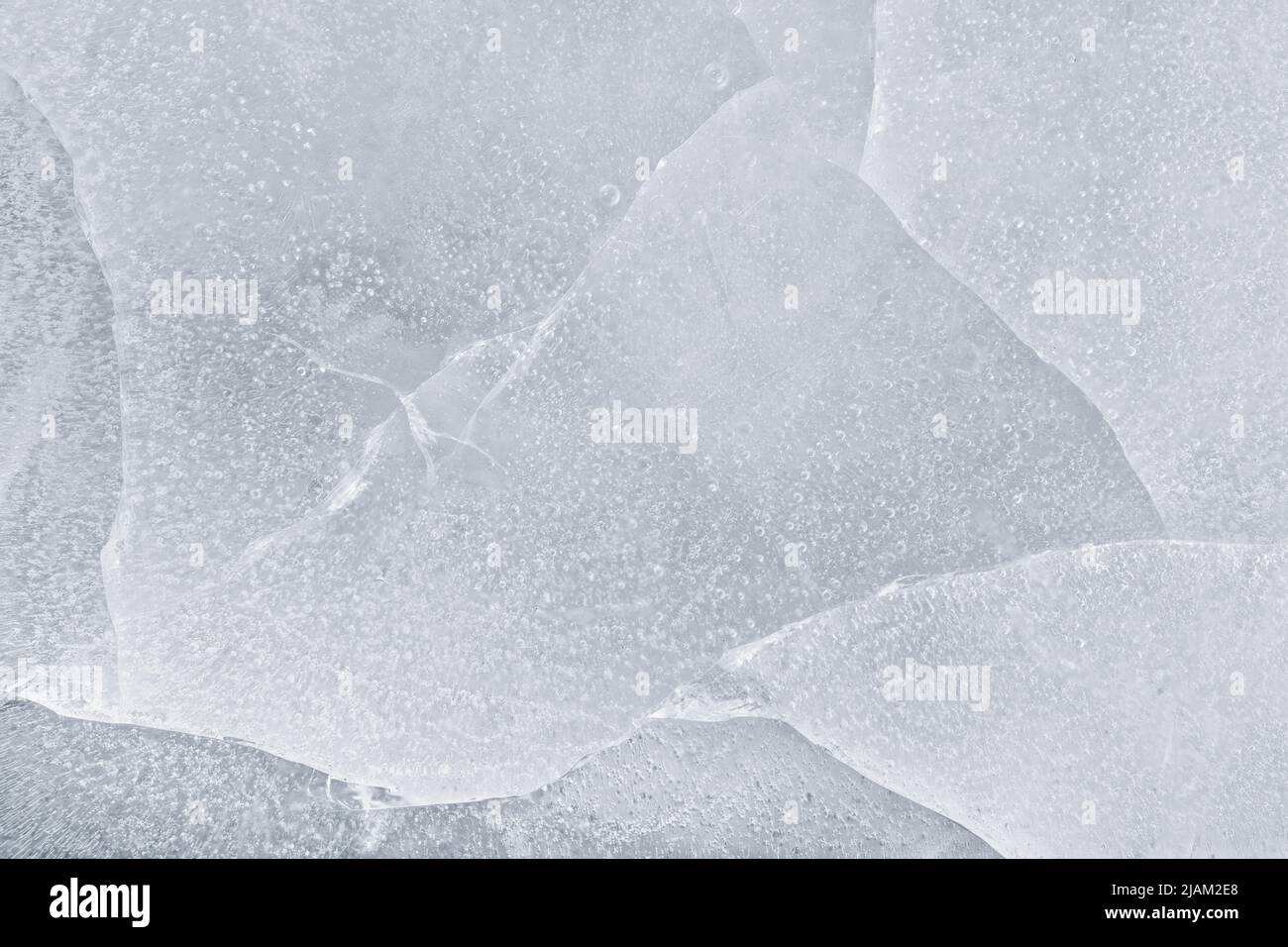 Ice cracked surface extreme close up. Ice macro texture and background Stock Photo